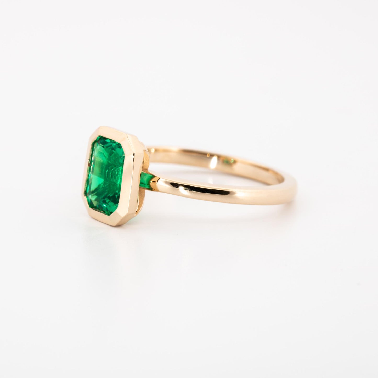14K Yellow gold bezel set lab grown emerald cut emerald, 1.15 ct