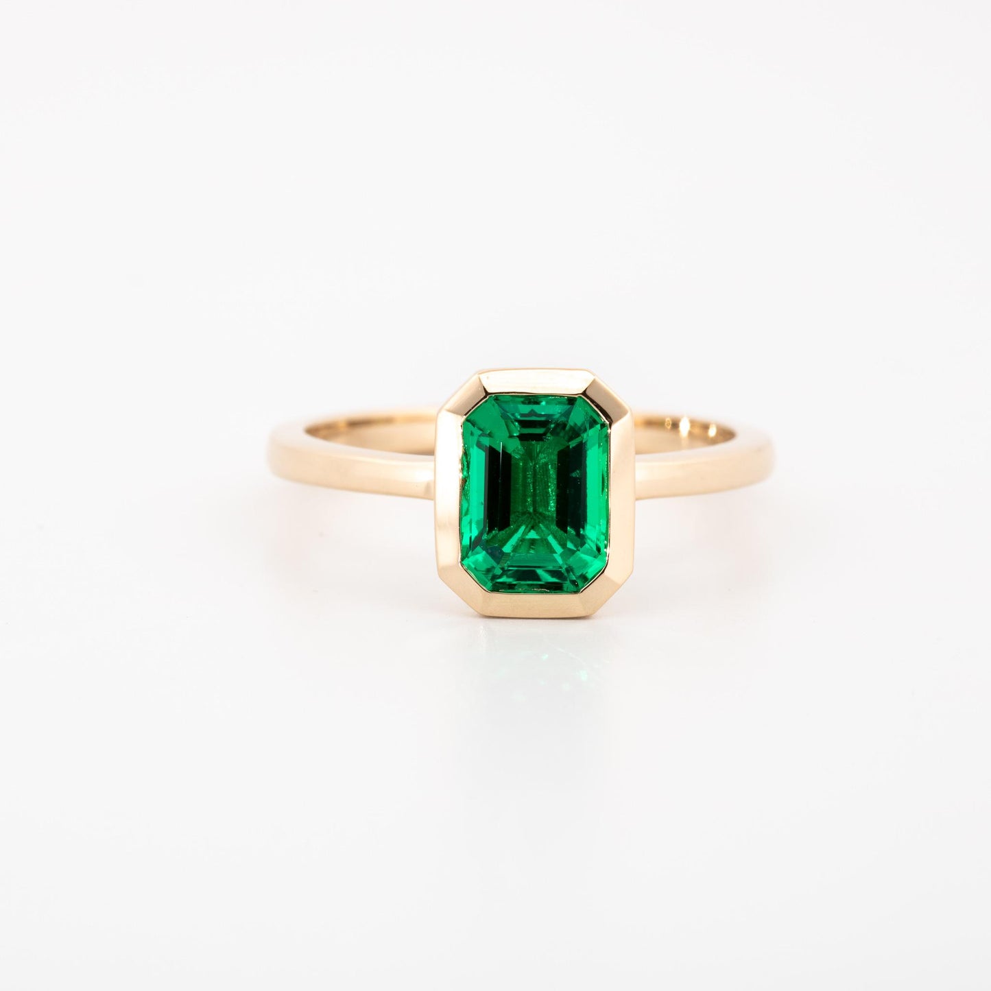 14K Yellow gold bezel set lab grown emerald cut emerald, 1.15 ct