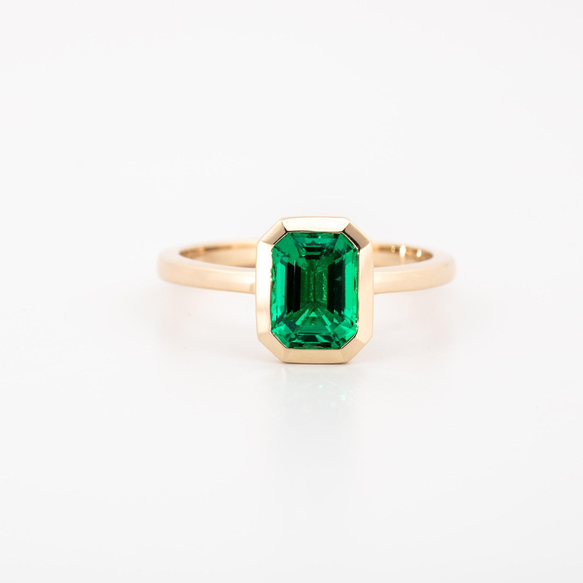 14K Yellow gold bezel set lab grown emerald cut emerald, 1.15 ct