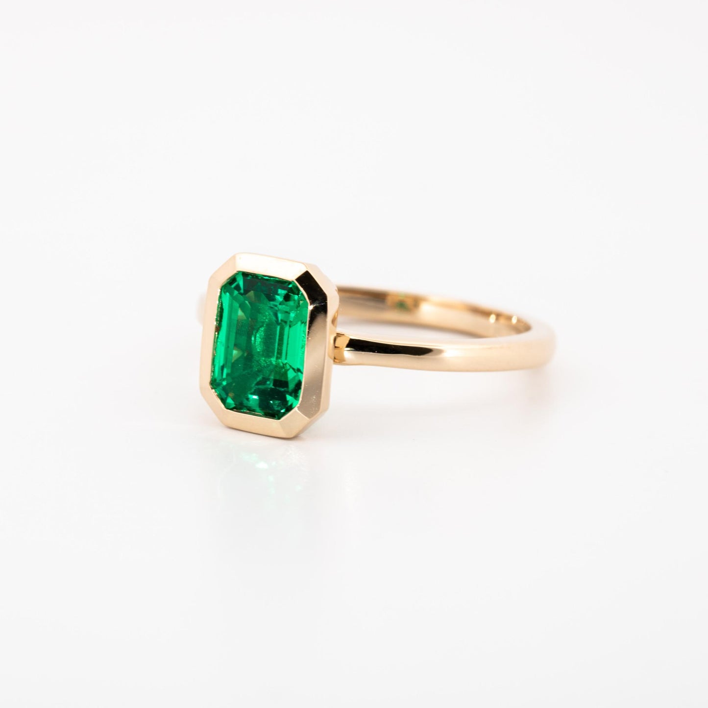 14K Yellow gold bezel set lab grown emerald cut emerald, 1.15 ct